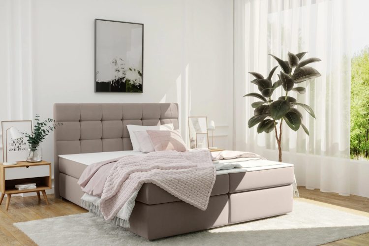 Modernes Boxspringbett in Beige in einem hellen Zimmer