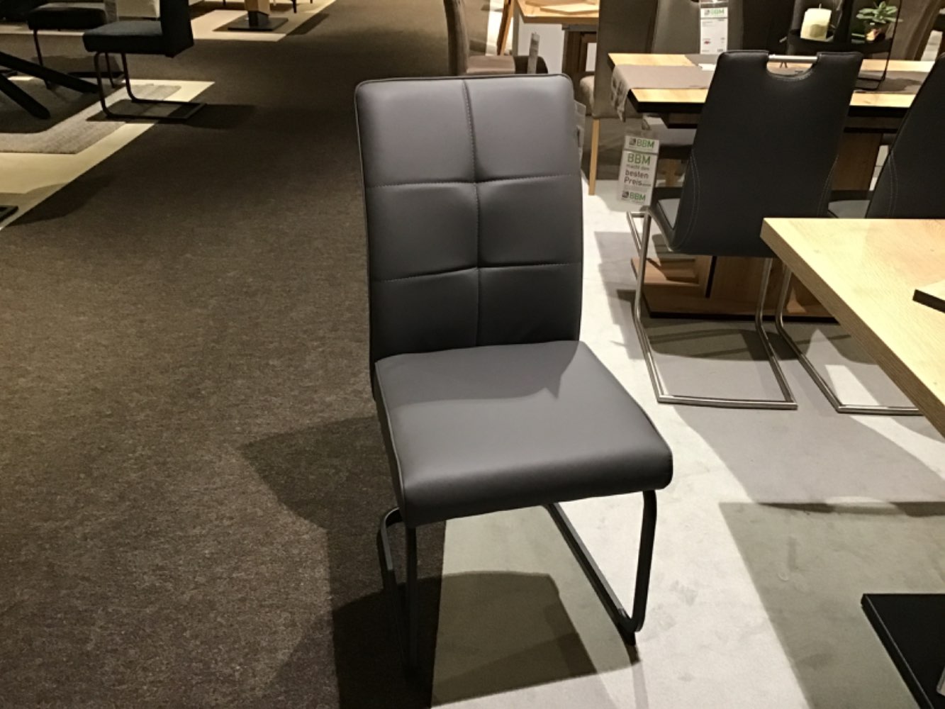 Schwingstuhl  Kunstleder grau.Gestell schwarz