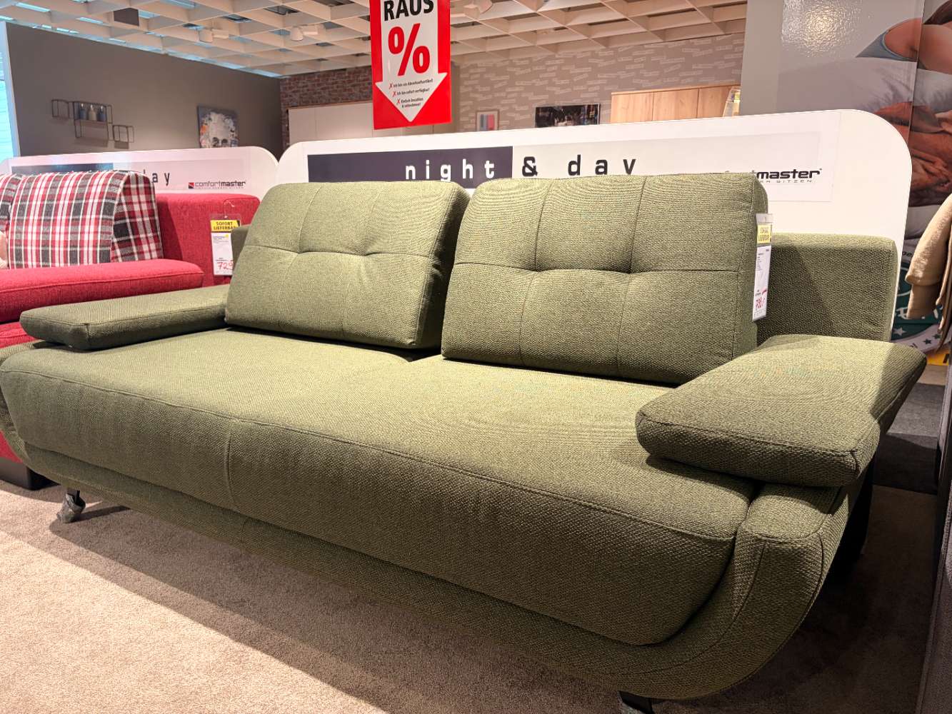 Grüne Schlafcouch mit Bettkasten